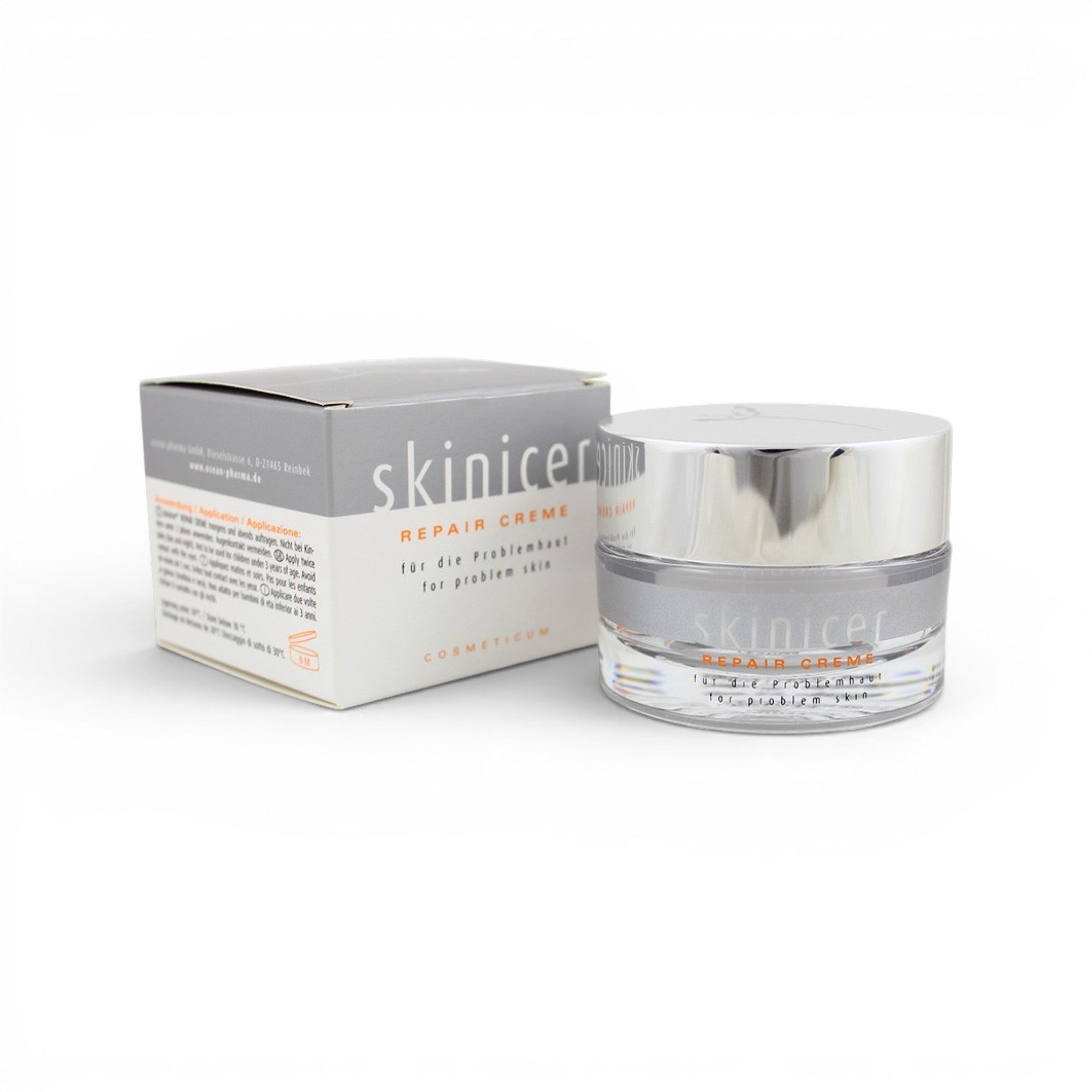Skincare repair cream jar and packaging on a white background