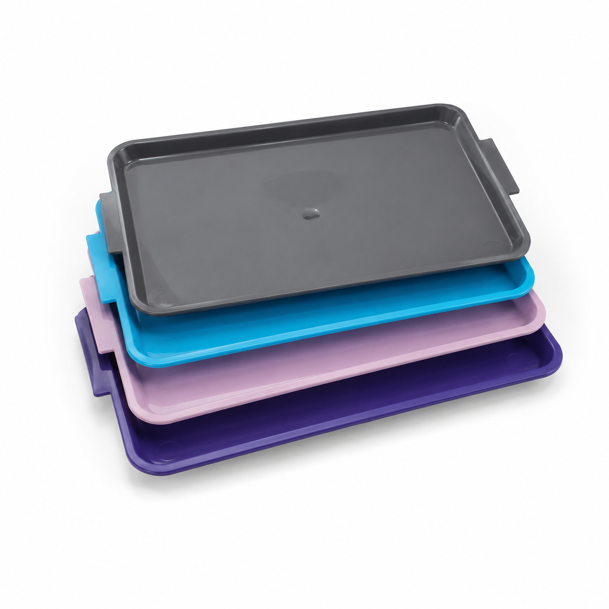 Set of four colorful RUCK® Large Instrument Trays stacked on a white background