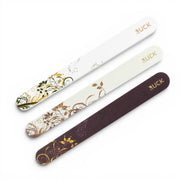 Three nail files with floral designs and 'RUCK' branding on a white background